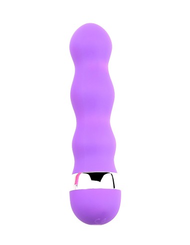 En  en mini vibromasseur violet avec une forme ondulée pour des plaisir plus intenses.